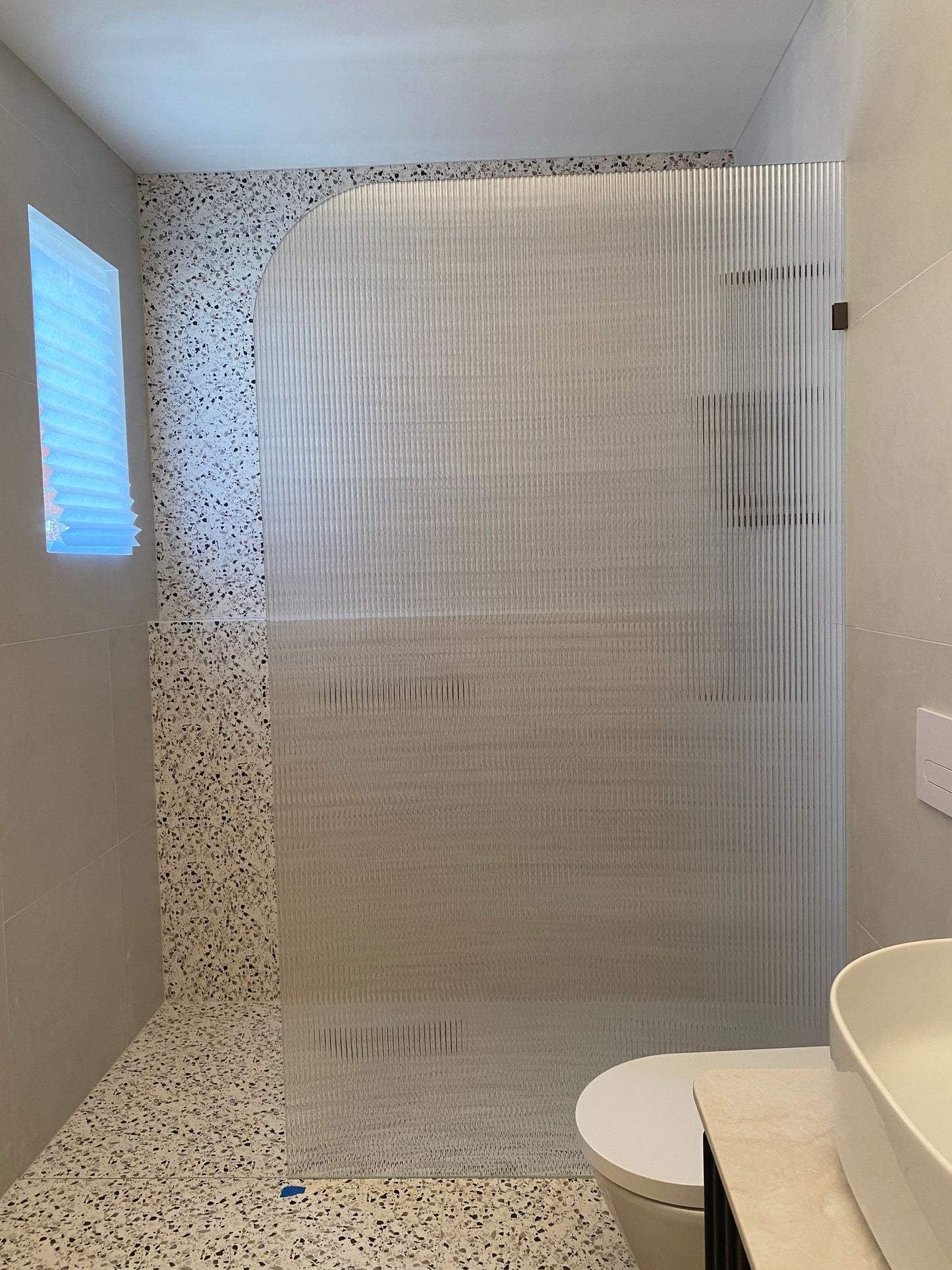 Fluted glass shower panel - radius corner - 1200mm wide